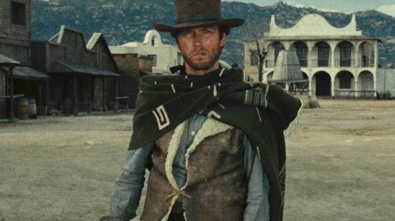 Joe wearing a serape in the street in A Fistful of Dollars
