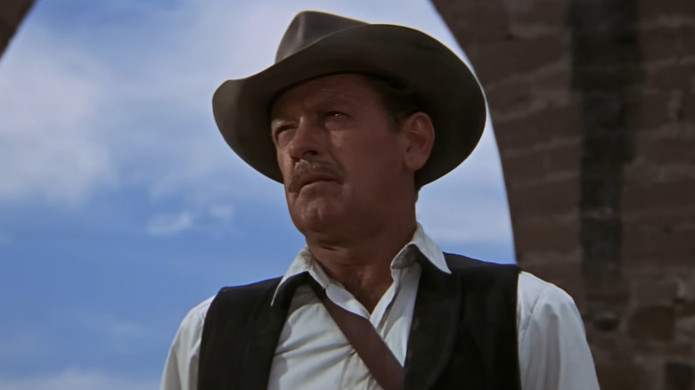 Pike scowling with the sky behind him in "The Wild Bunch" (1969)
