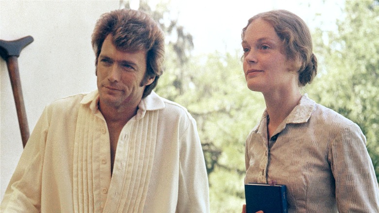 John McBurney and Edwina sitting outside in The Beguiled (1971)