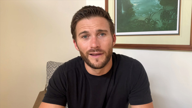 Scott Eastwood seated chair