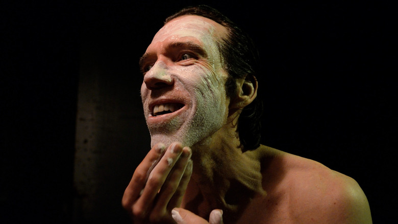 Doom-Head applies his clown makeup in "31" (2016)