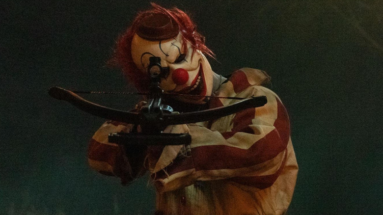 Frendo the Clown with a crossbow in "Clown in a Cornfield" (2025)