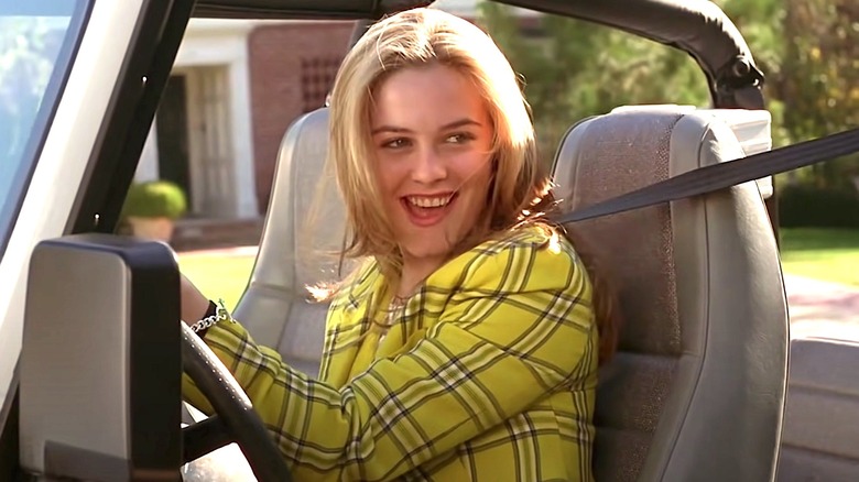 Cher driving a jeep