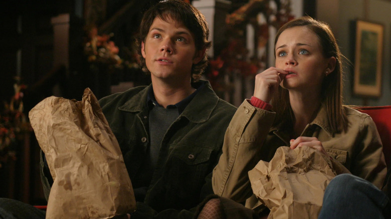 Dean and Rory watching a movie on Gilmore Girls