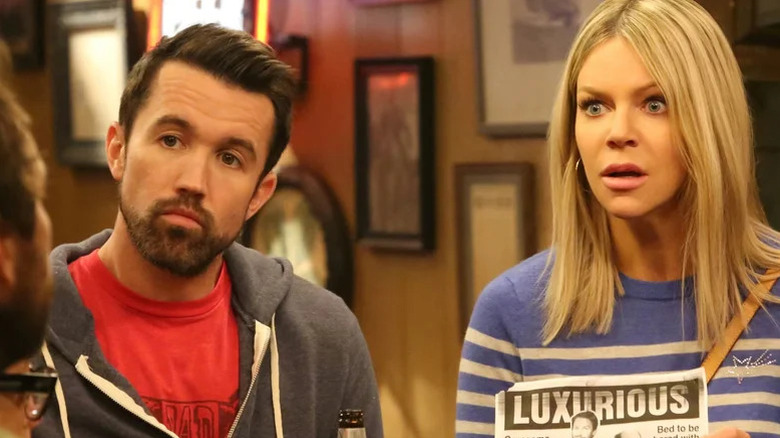 Mac and Dee looking at someone speaking on It's Always Sunny in Philadelphia