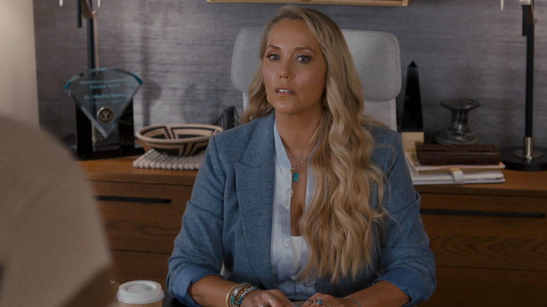 Jessie sits at a desk on "Saved by the Bell" (2020-2021)