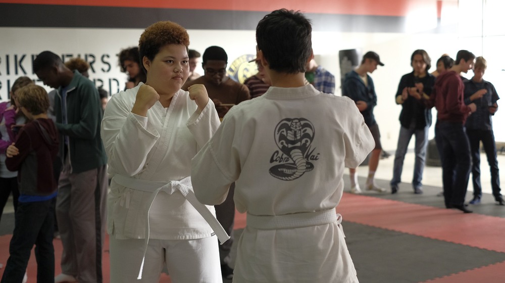 Aisha fighting with Miguel in Cobra Kai dojo