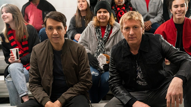 Ralph Macchio and William Zabka sitting together