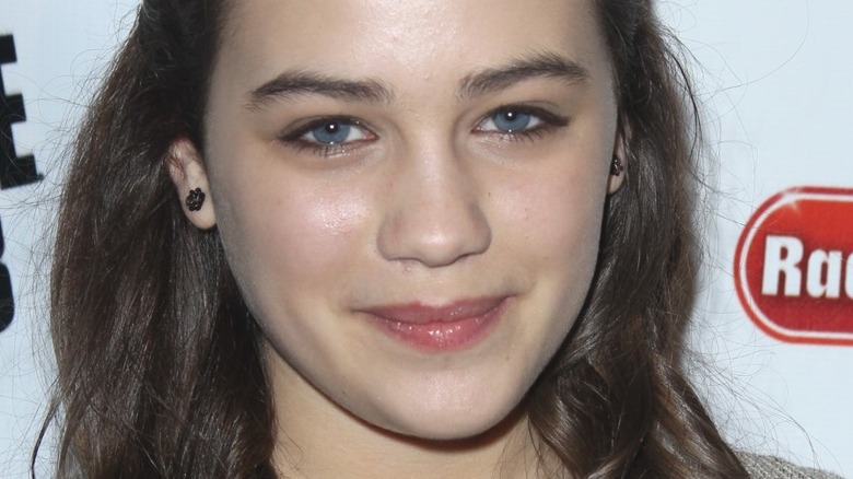 Mary Mouser smiles