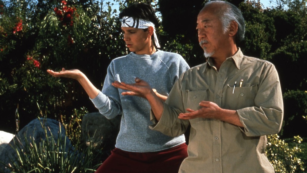 Ralph Macchio and Pat Morita working out in The Karate Kid