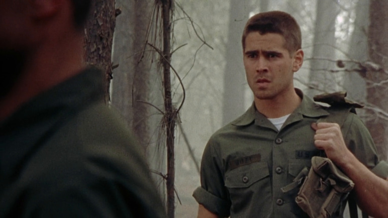 Roland Bozz wearing fatigues in woods