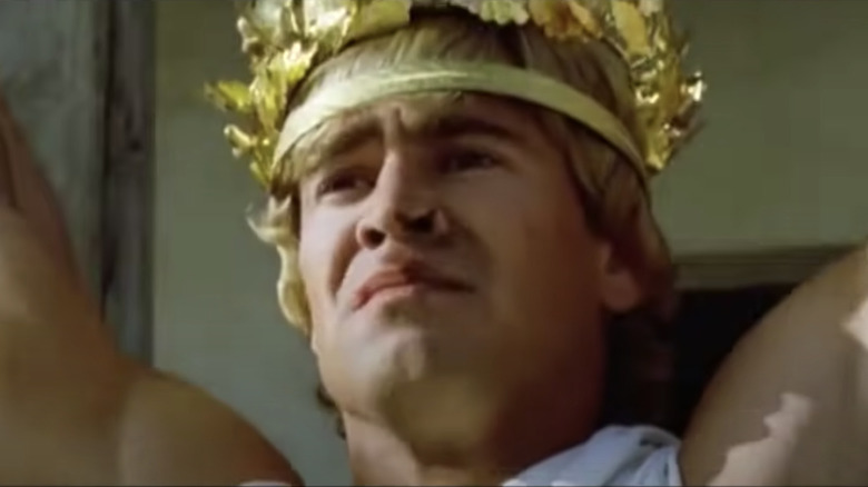 Farrell playing Alexander the Great wearing a headpiece of golden leaves