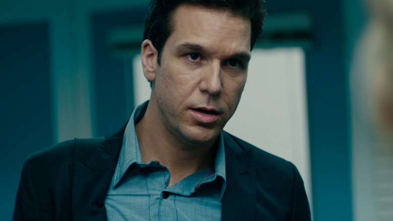 Ryan in blue suit and blazer in Answers to Nothing (2011)