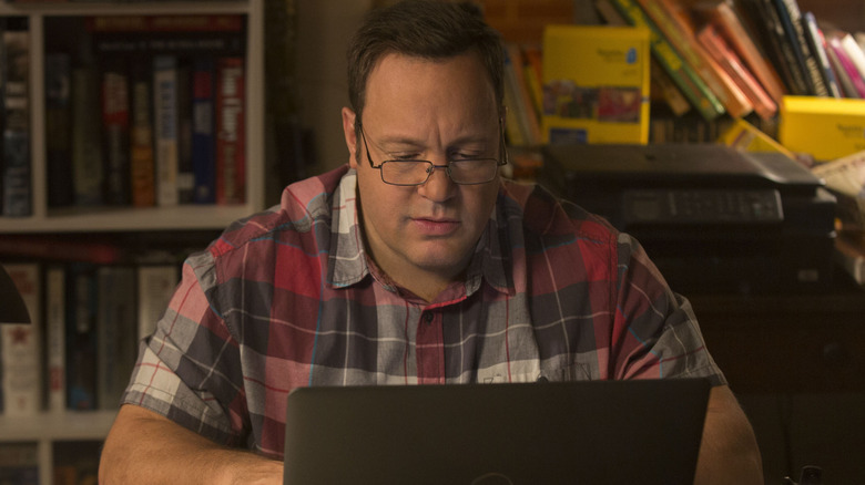 Sam Larson typing on his computer  in The True Memoirs of an International Assassin