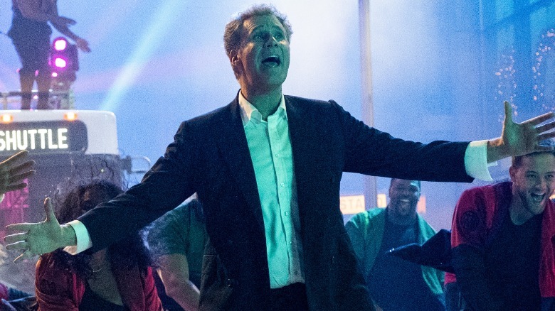 Ebenezer Scrooge singing in crowd