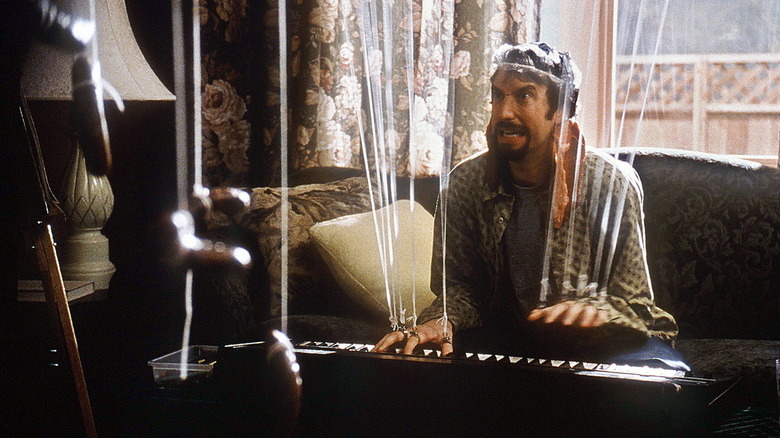 Gordon Brody grimacing while playing a keyboard in Freddy Got Fingered