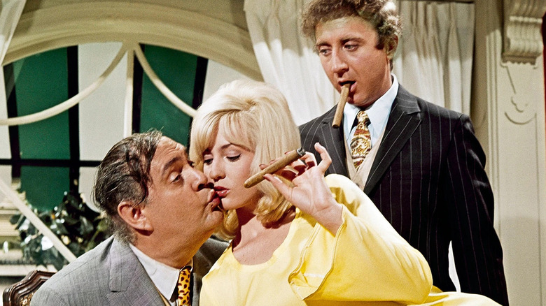 Max Bialystock, Ulla and Leo Bloom with cigars in The Producers