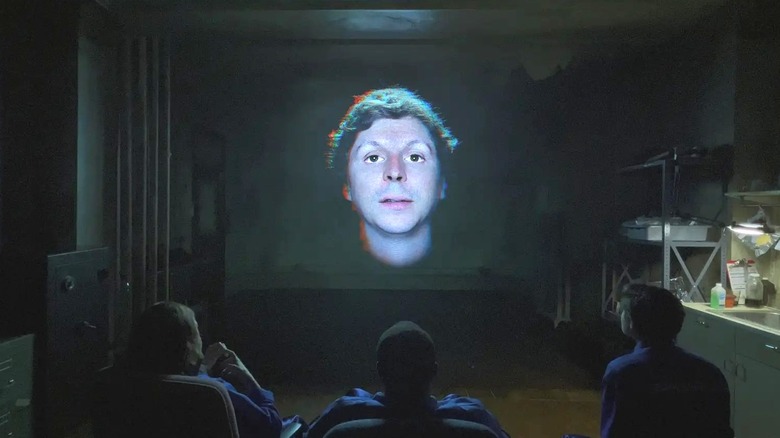 Michael Cera's disembodied head on screen in front of viewers