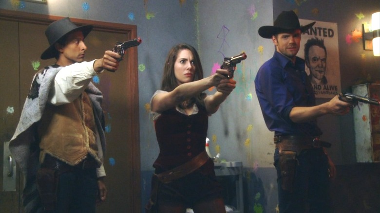 Abed, Annie, and Jeff pointing paintball guns in "Community"