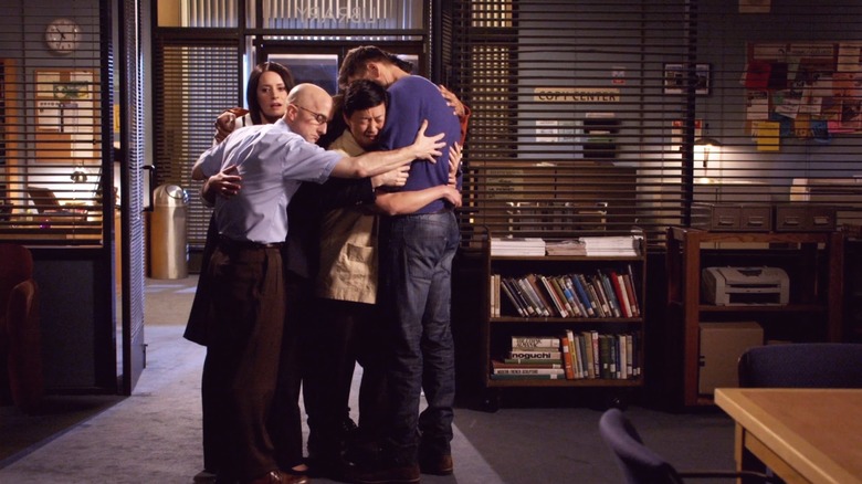 The study group, Dean, and Chang hugging in "Community"