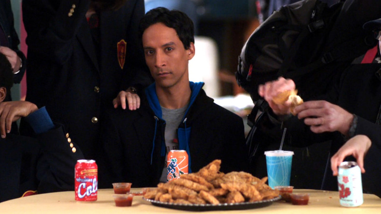 Abed sitting in front of chicken fingers in "Contemporary American Poultry" (2010)