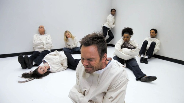 The study group in straight jackets in "Paradigms of Human Memory" (2011)