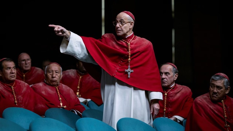 Cardinal Aldo Bellini standing up and pointing