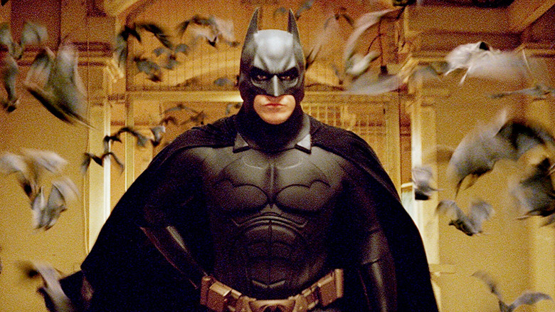 Batman surrounded by bat