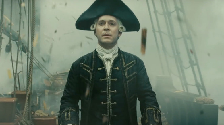 Lord Beckett stands aboard is broken ship