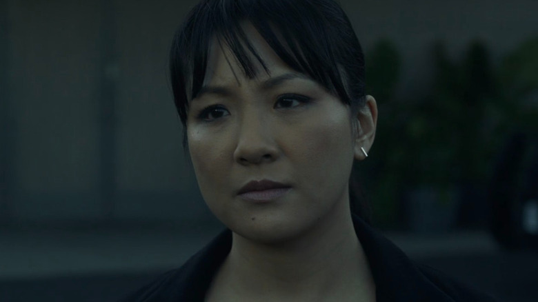 Constance Wu seriously looks straight ahead