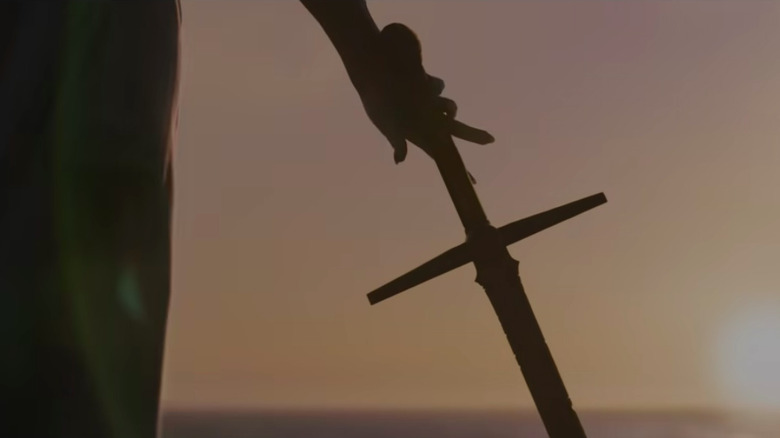 Necrosword with a hand holding it
