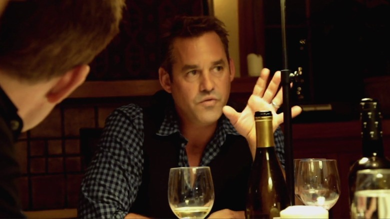 Mike talking at dinner table in Coherence (2013)