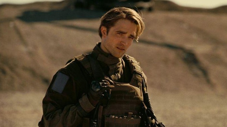 Neil wearing military gear in Tenet (2020)
