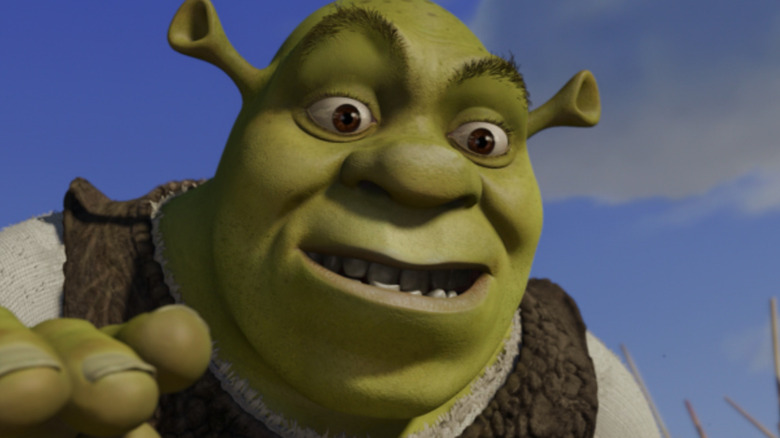 Shrek reaches down wide eyed