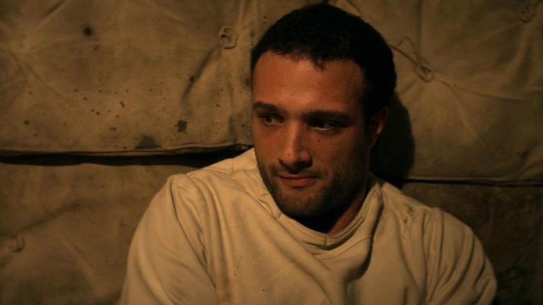 Barney sitting in a padded room in 