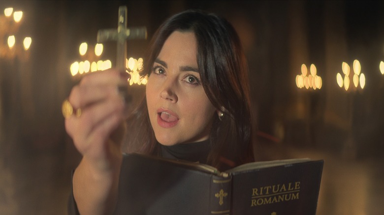 Johanna Constantine holding book and cross