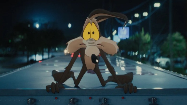 Wile E. Coyote on top of a vehicle in Coyote vs. Acme