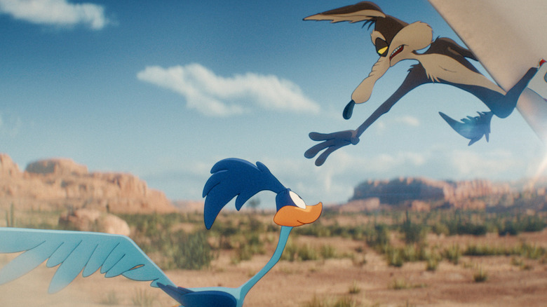 Riding a rocket, Wile E. Coyote reaching toward the Road Runner in the desert in "Coyote vs. Acme" (2026)
