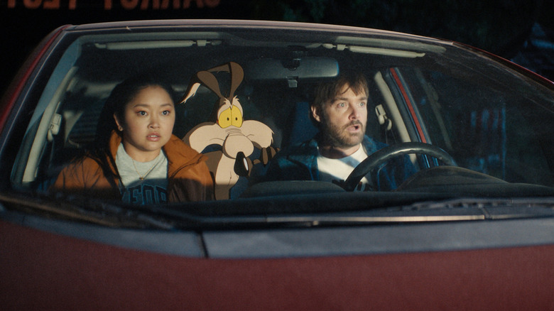 Paige, Wile E. and Kevin looking surprised inside a car in "Coyote vas. Acme" (2026)