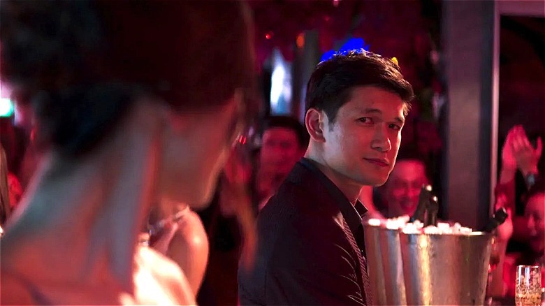 Astrid looking at Charlie during Nick and Rachel's engagement party in "Crazy Rich Asians"