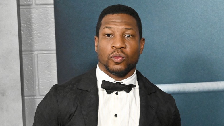 Jonathan Majors posing at event