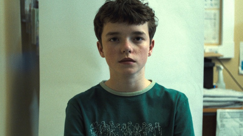 Jamie with a blank expression in 