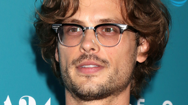 Matthew Gray Gubler with glasses on posing on red carpet