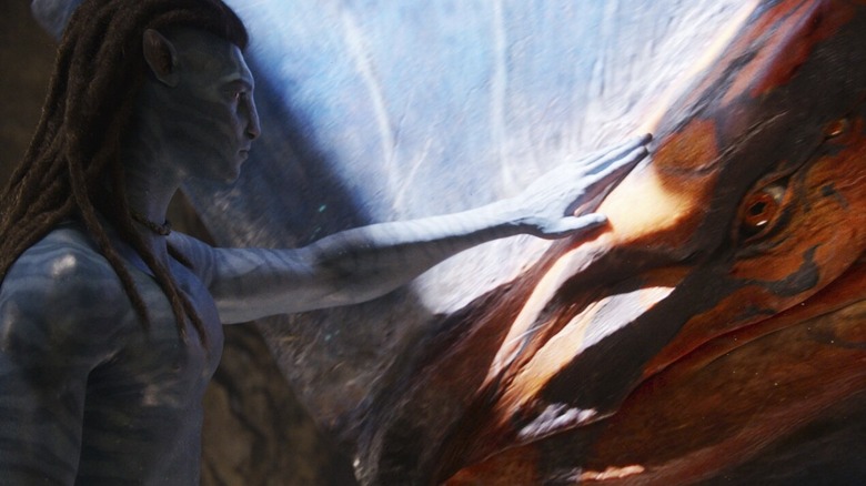 Jake Sully pats a Toruk in "Avatar: Fire and Ash" (2025)