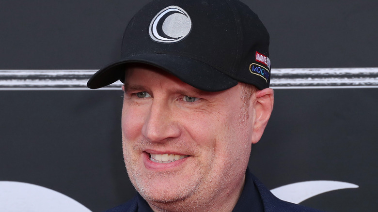 Marvel Studios executive Kevin Feige posing for a photo at the Moon Knight premiere