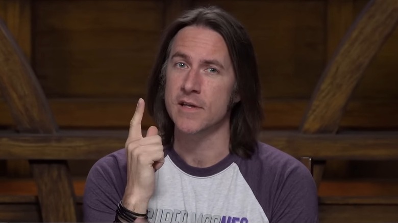 Matt Mercer holds hand up