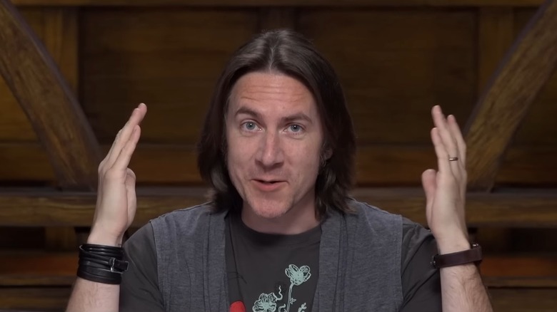 Matthew Mercer smiling mid-sentence