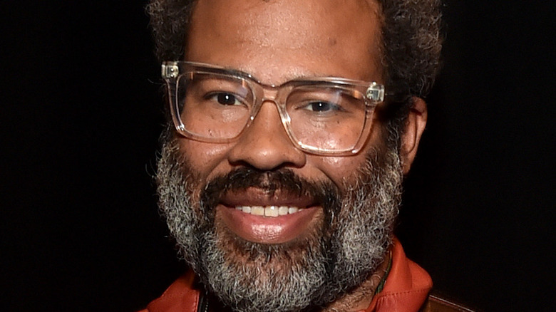 Jordan Peele smiling at a premiere