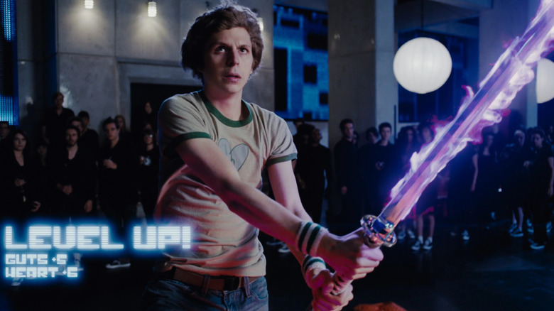 Scott leveling up with a glowing sword in Scott Pilgrim vs. The World