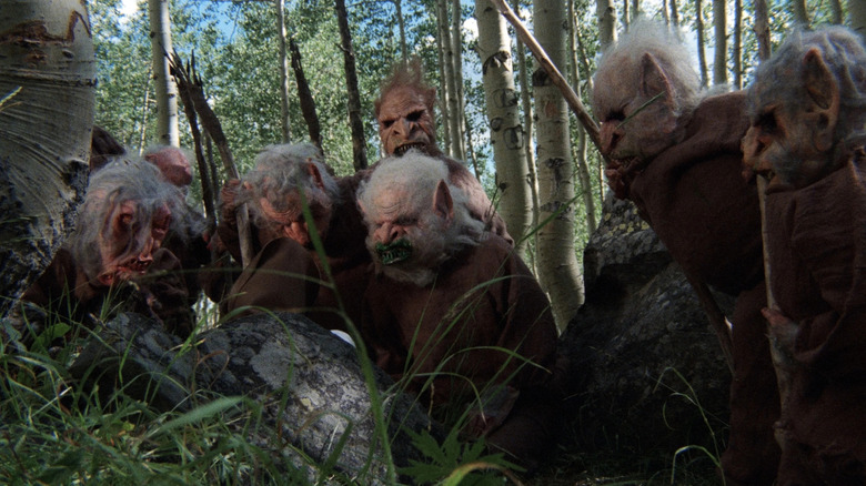 Goblins carrying arrows in the woods in Troll 2